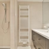 A modern tiled bathroom interior in bright colors