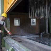 Working in metal processing factory.